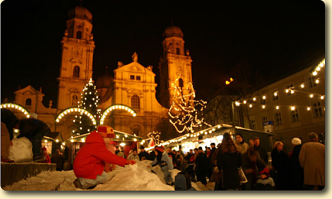 Passau Christmas Market, St.Stephan's Cathedral and child playing in snow 